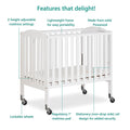 Dream on Me 2 - in - 1 Folding Portable Mini Crib in White. Mattress Pad Included. Easy to Fold and Store Baby Crib. Two Adjustable Mattress Height Positions Convertible Crib